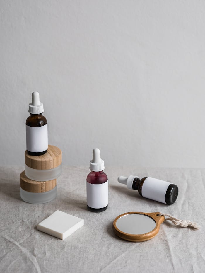 Elegant skincare bottles arranged on a linen backdrop, highlighting minimalist design.